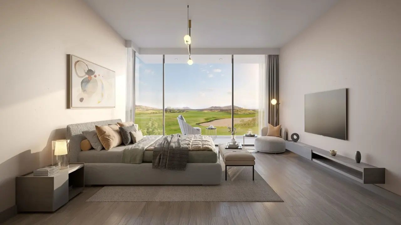 Bedroom with a sea view through floor-to-ceiling windows