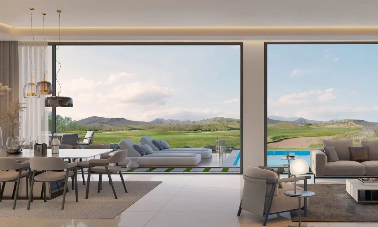 Living and dining area with a pool and golf course view in an AIDA Oceana villa