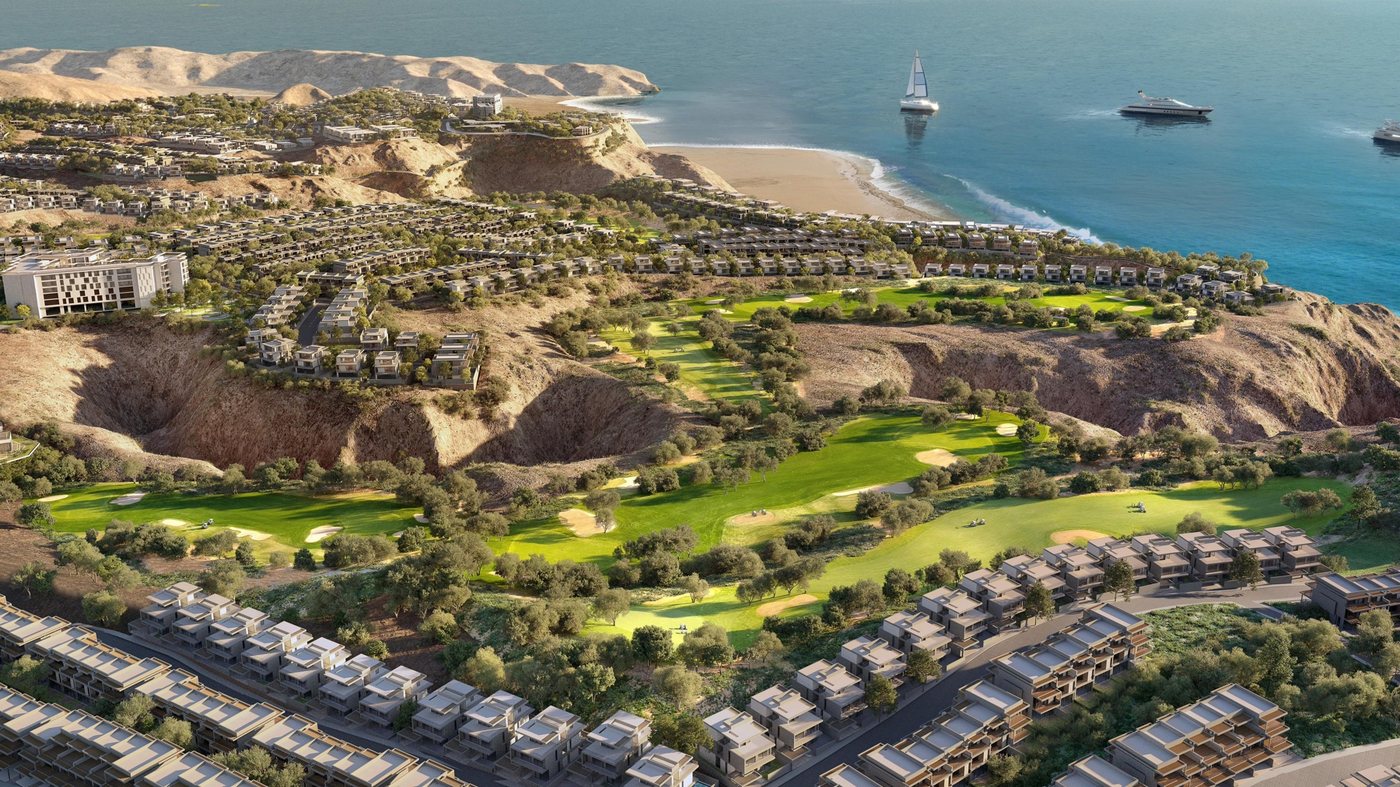 Aerial view of the golf course valley, the villas and the beach of AIDA